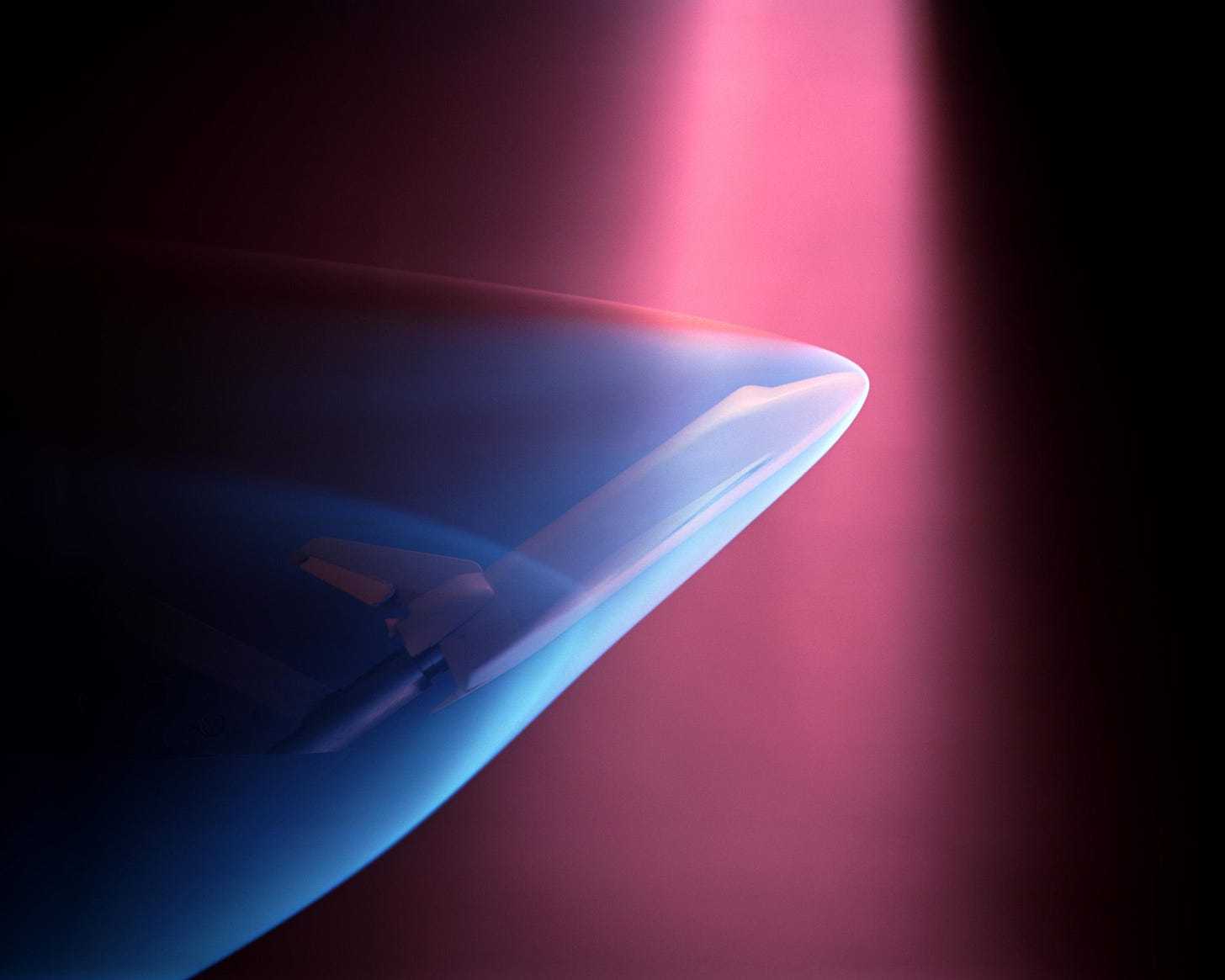 A fascinating NASA wind tunnel test from April 14, 1975, showing a Space Shuttle model targeted by an electron beam to simulate re-entry ionization.
