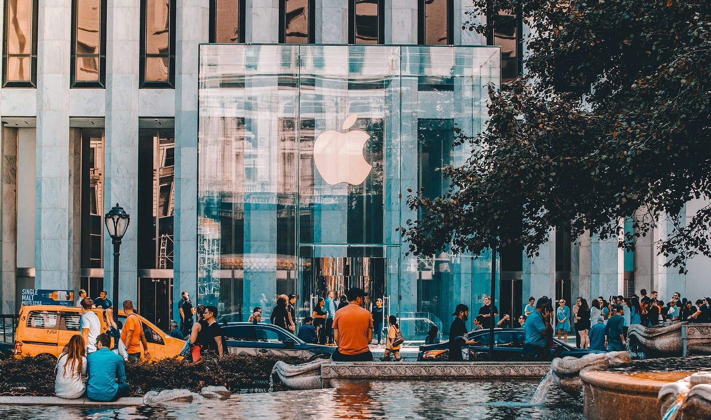 A man sitting outside of the majestic architecture masterpiece that is the Apple Store at Fifth Avenue in New York City. Just days after the iPhone 11 was released. A man sitting outside of the majestic architecture masterpiece that is the Apple Store at Fifth Avenue in New York City. Just days after the iPhone 11 was released.
