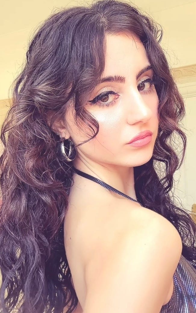 The Beauty Ed® Gia wearing a multi-colored Euphoria-inspired eye look with pink and blue wing details using Half Magic Beauty. The Beauty Ed® Gia wearing a multi-colored Euphoria-inspired eye look with pink and blue wing details using Half Magic Beauty.