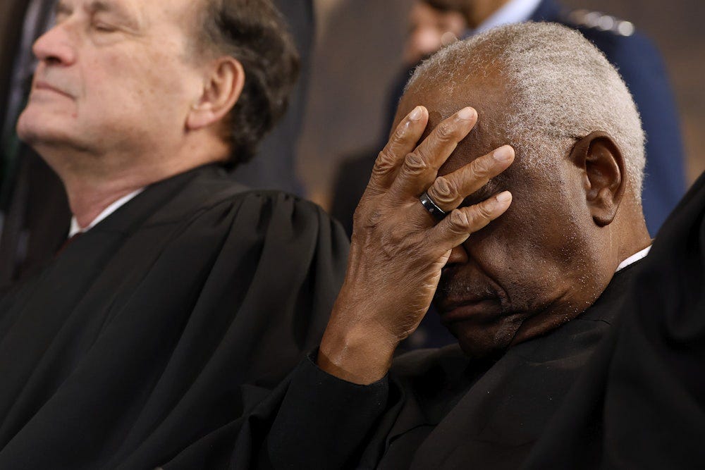 Supreme Court Associate Justice Clarence Thomas covers his face as he waits for the opportunity to leave the stage at the conclusion of Trump’s second inauguration ceremonies. Supreme Court Associate Justice Clarence Thomas covers his face as he waits for the opportunity to leave the stage at the conclusion of Trump’s second inauguration ceremonies.
