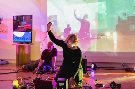 Images of performances in gallery space with artists using various types of sound and projection equipment  