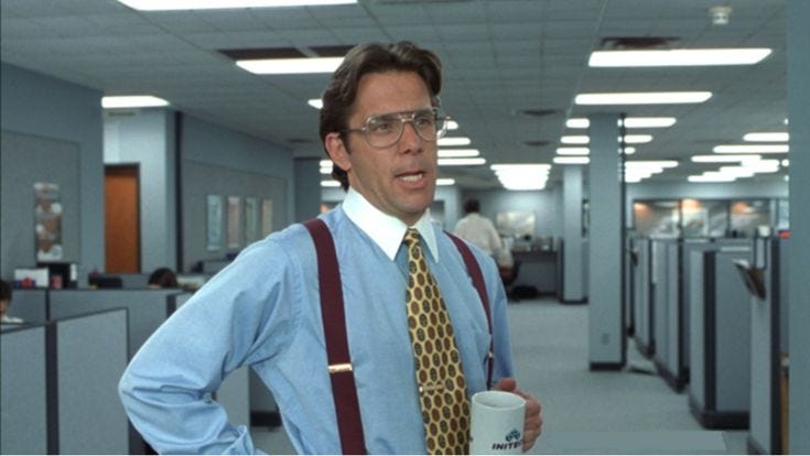 This may contain: a man in an office cubicle wearing suspenders and holding a coffee cup with his hands on his hips This may contain: a man in an office cubicle wearing suspenders and holding a coffee cup with his hands on his hips