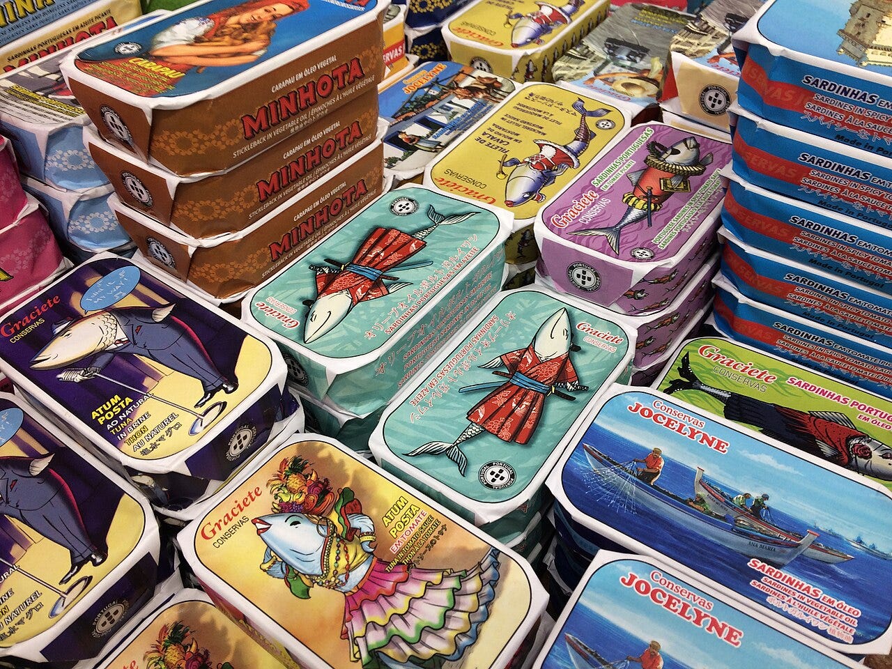 canned sardines — Tins of sardines. Photo by Cbuske46 / CC BY-SA 4.0, via Wikimedia Commons canned sardines — Tins of sardines. Photo by Cbuske46 / CC BY-SA 4.0, via Wikimedia Commons