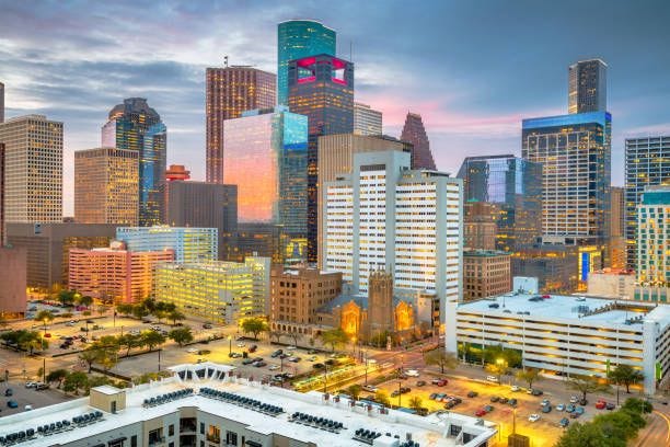 Houston, Texas, USA Downtown Skyline at Dusk Houston, Texas, USA rooftop downtown city skyline at dusk. downtown houston stock pictures, royalty-free photos & images