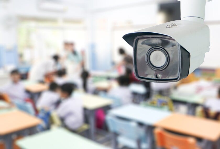 CCTV Security monitoring student in classroom at school.