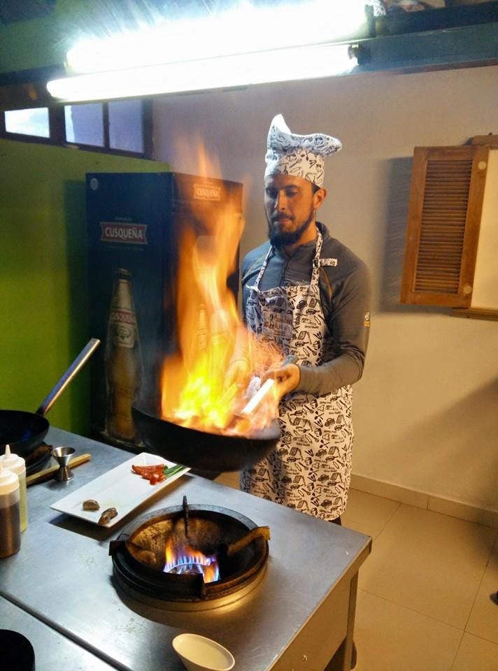 Eddie learning how to cook some Peruvian classics, such as Lomo Saltado