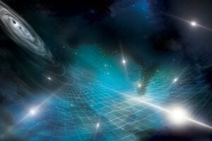 This artist’s concept shows stars, black holes, and nebula laid over a grid representing the fabric of space-time. Ripples in this fabric are called gravitational waves. The NANOGrav collaboration detected evidence of gravitational waves created by black holes billions of times the mass of the Sun. Credit: NANOGrav collaboration; Aurore Simonet