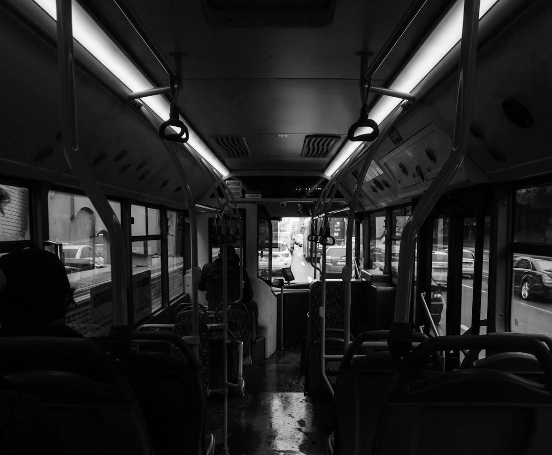 people sitting inside train during daytime people sitting inside train during daytime