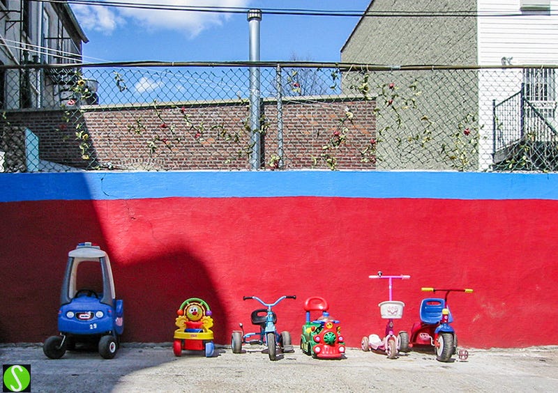 photo by Steve Butcher of line up of childrens' toys parked