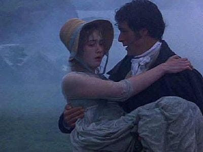 This may contain: a man and woman are hugging in the fog This may contain: a man and woman are hugging in the fog