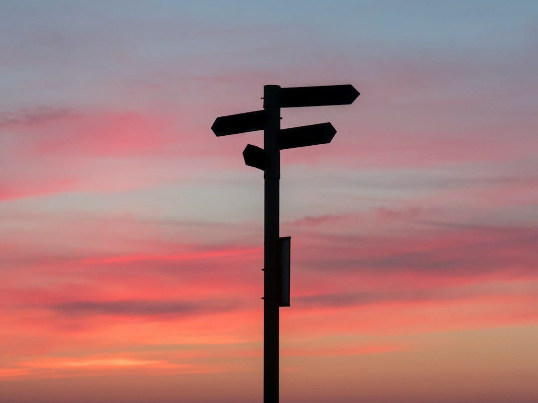 silhouette of a road signage during golden hour