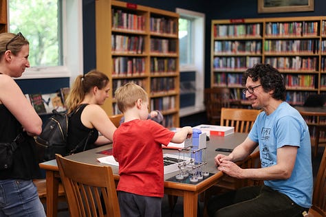 Nine square images from STEM Day, including two students 3d designing, a student sharing his Mars Rover Scratch game, a little kid building with MOLA kit, 3D-Click activities, Tiny robots!, Exploring resources