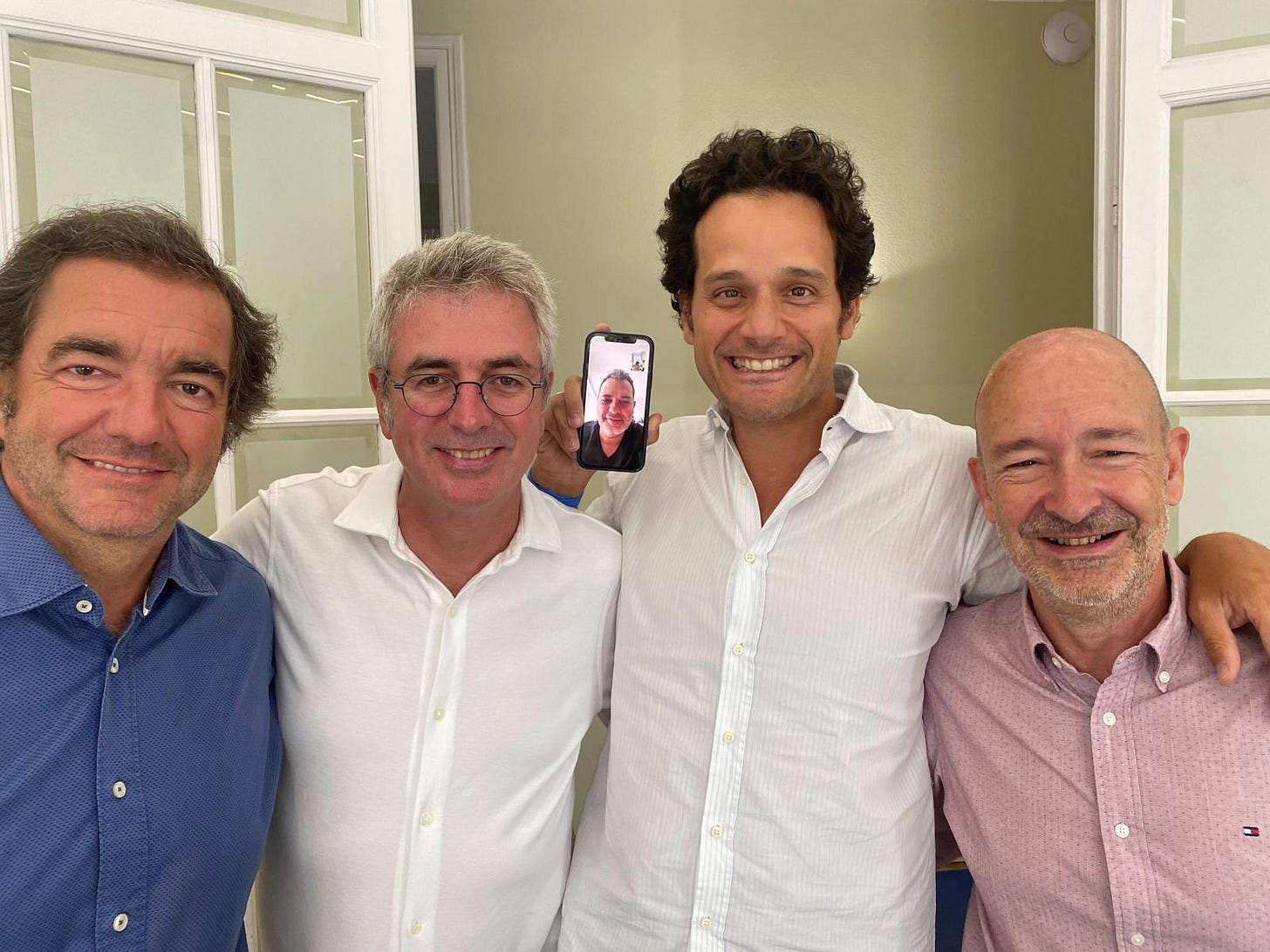 A group of men posing for a picture

AI-generated content may be incorrect.