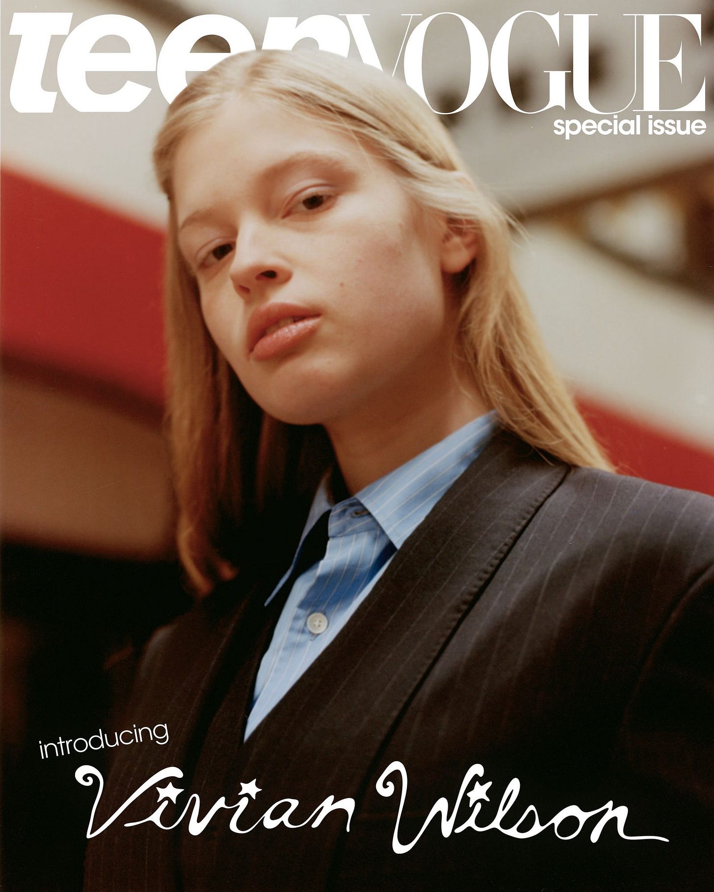 Closeup portrait looking up at Vivian looking directly towards viewer. She is pictured wearing a pinstripe jacket and... Closeup portrait looking up at Vivian looking directly towards viewer. She is pictured wearing a pinstripe jacket and...