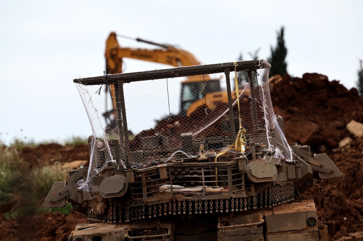 An Israeli tank fitted with a net to protect it from FPV drones. An Israeli tank fitted with a net to protect it from FPV drones.