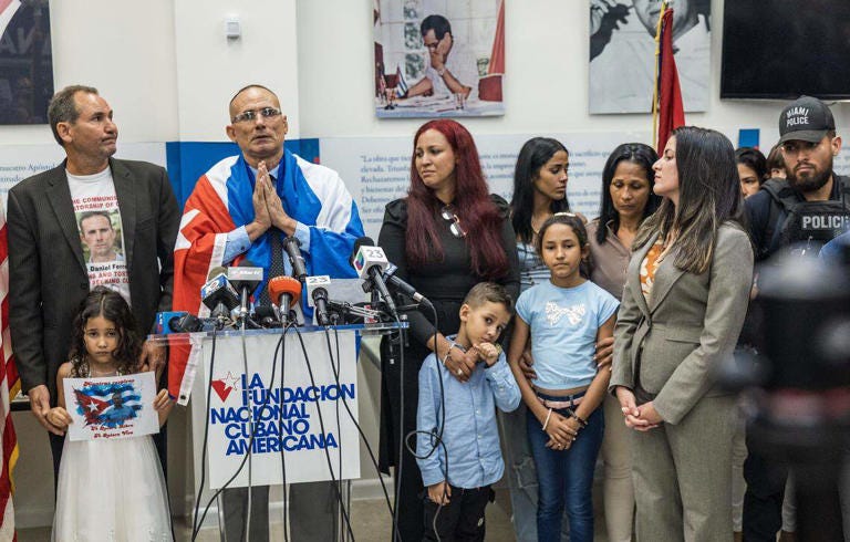 A group of people standing in front of microphones

AI-generated content may be incorrect.