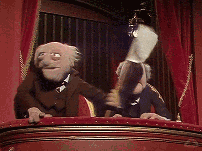 Muppets Statler and Waldorf waving a white flag from the balcony — humorous reaction meme symbolizing surrender or frustration, used to illustrate investor sentiment toward corporate blunders or stock decline.