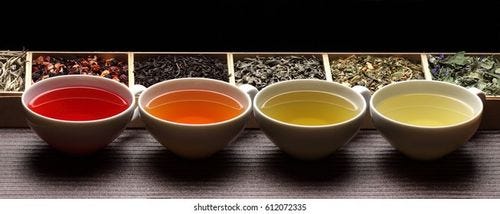 Black, green, herbal tea  cups / tea assortment in boxes