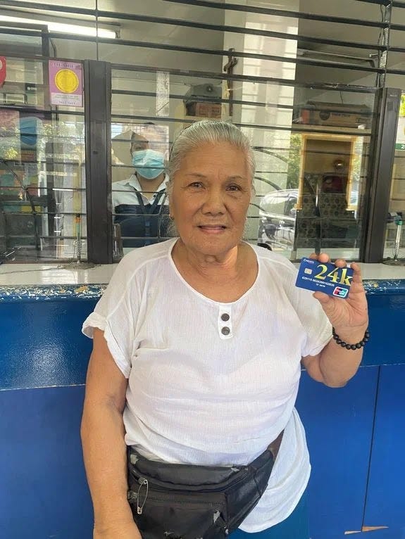 Cebuana Lhuillier Micro Savings customer holding an ATM card