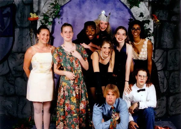 The ensemble was often paired with a bow tie or necktie, and a coordinating vest or cummerbund that matched the color of their date’s dress.