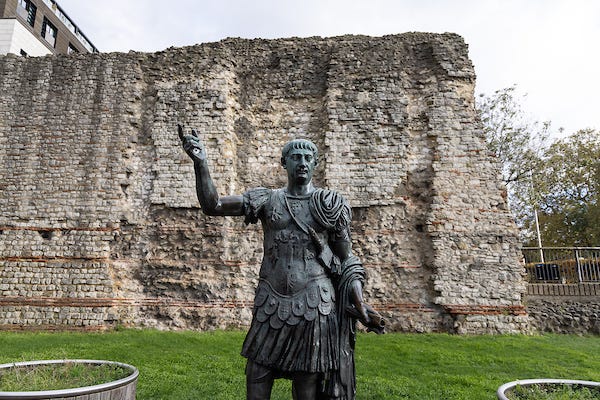 Roman City Wall, with a statue of a Roman in front. Roman City Wall, with a statue of a Roman in front.