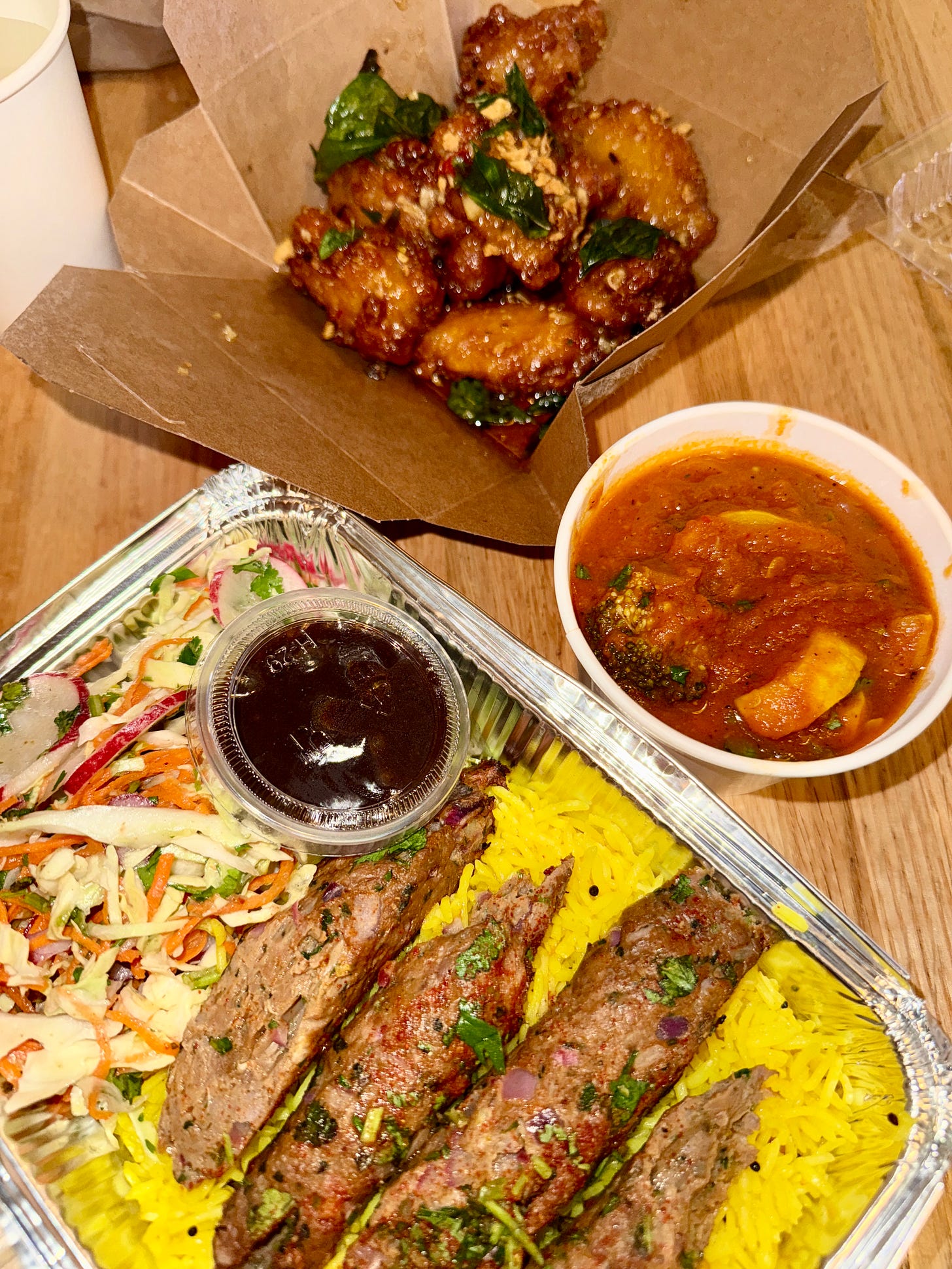 Bail chicken wings from White Elephant, Lamb Kehek with yellow rice & cabbage slaw with a side of vegetarian red curry from Adya Bail chicken wings from White Elephant, Lamb Kehek with yellow rice & cabbage slaw with a side of vegetarian red curry from Adya