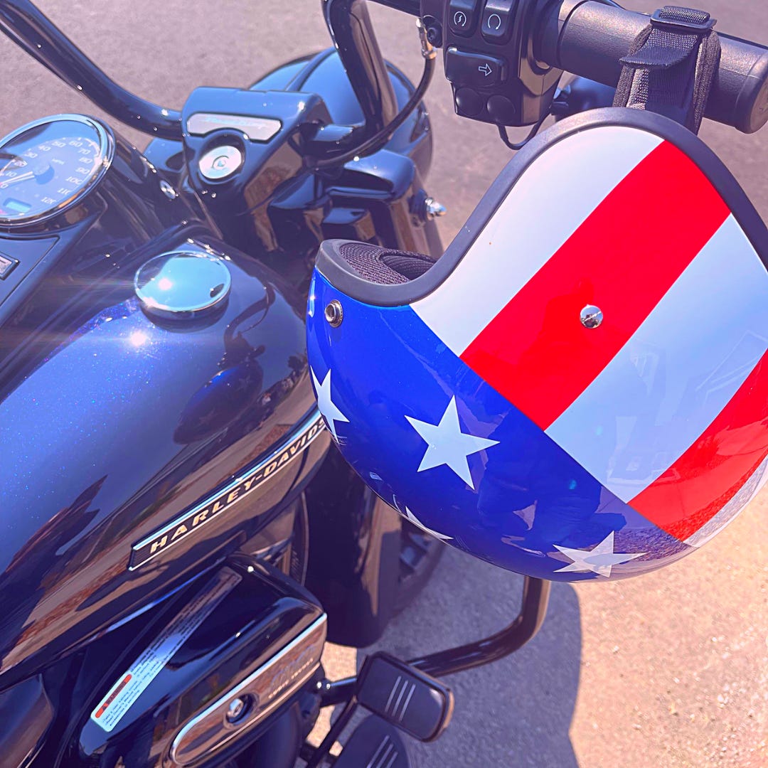 U.S. flag motorcycle helmet hanging on Harley-Davidson