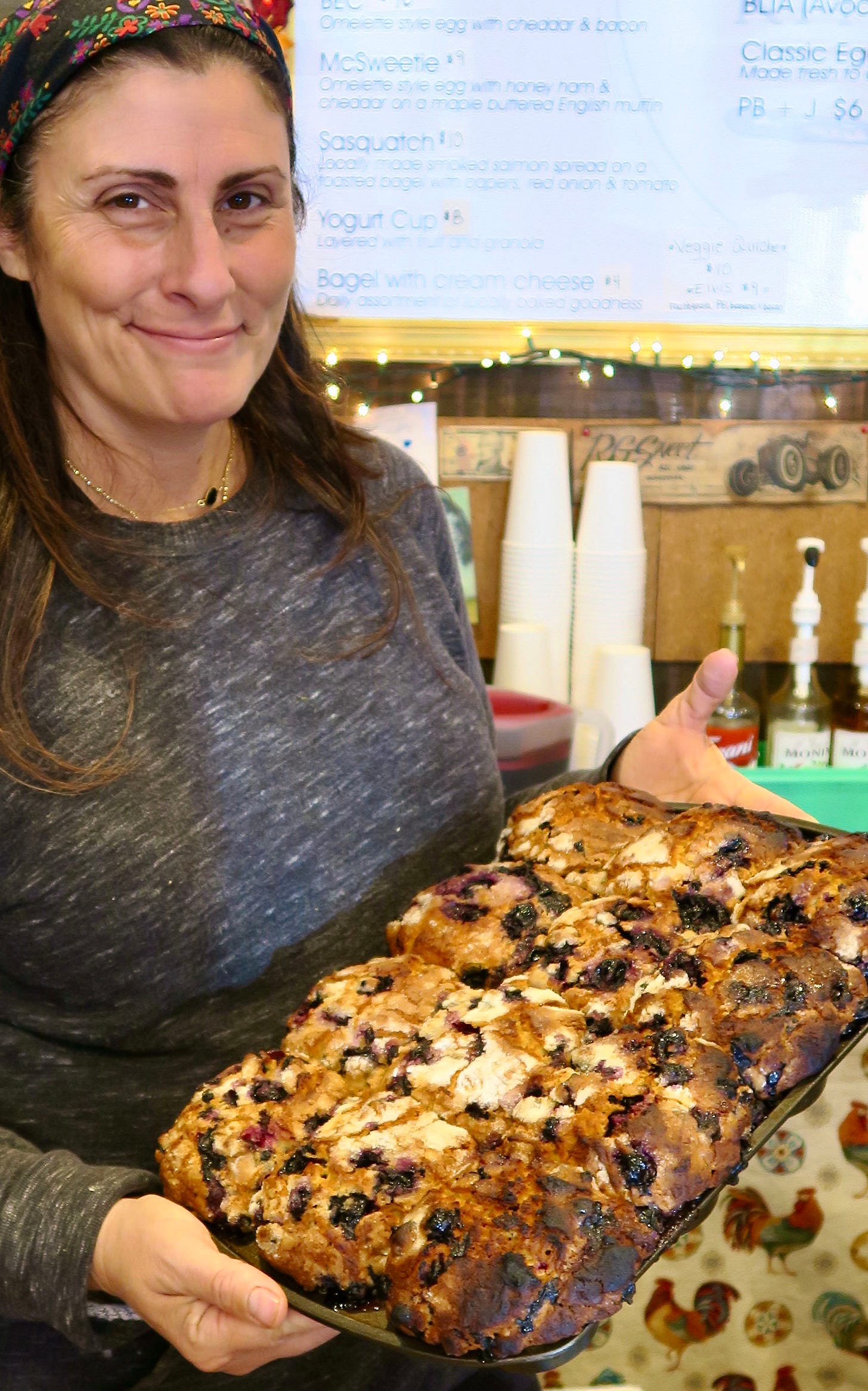 A person holding a pizza

Description automatically generated with medium confidence