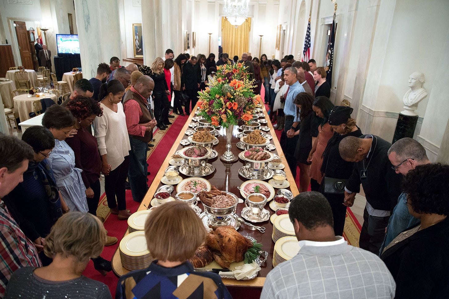 November 24, 2016: President Obama leads a heartfelt prayer before hosting Thanksgiving dinner for family and friends on the State Floor of the White House. November 24, 2016: President Obama leads a heartfelt prayer before hosting Thanksgiving dinner for family and friends on the State Floor of the White House.
