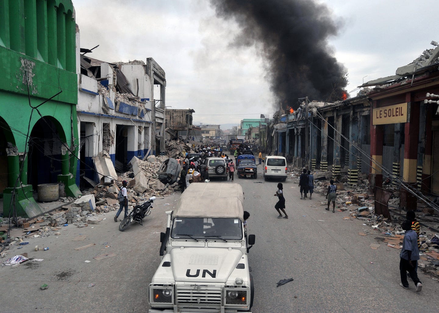 Earthquake devastated urban area in Haiti; A UN truck moseys on by. Earthquake devastated urban area in Haiti; A UN truck moseys on by.
