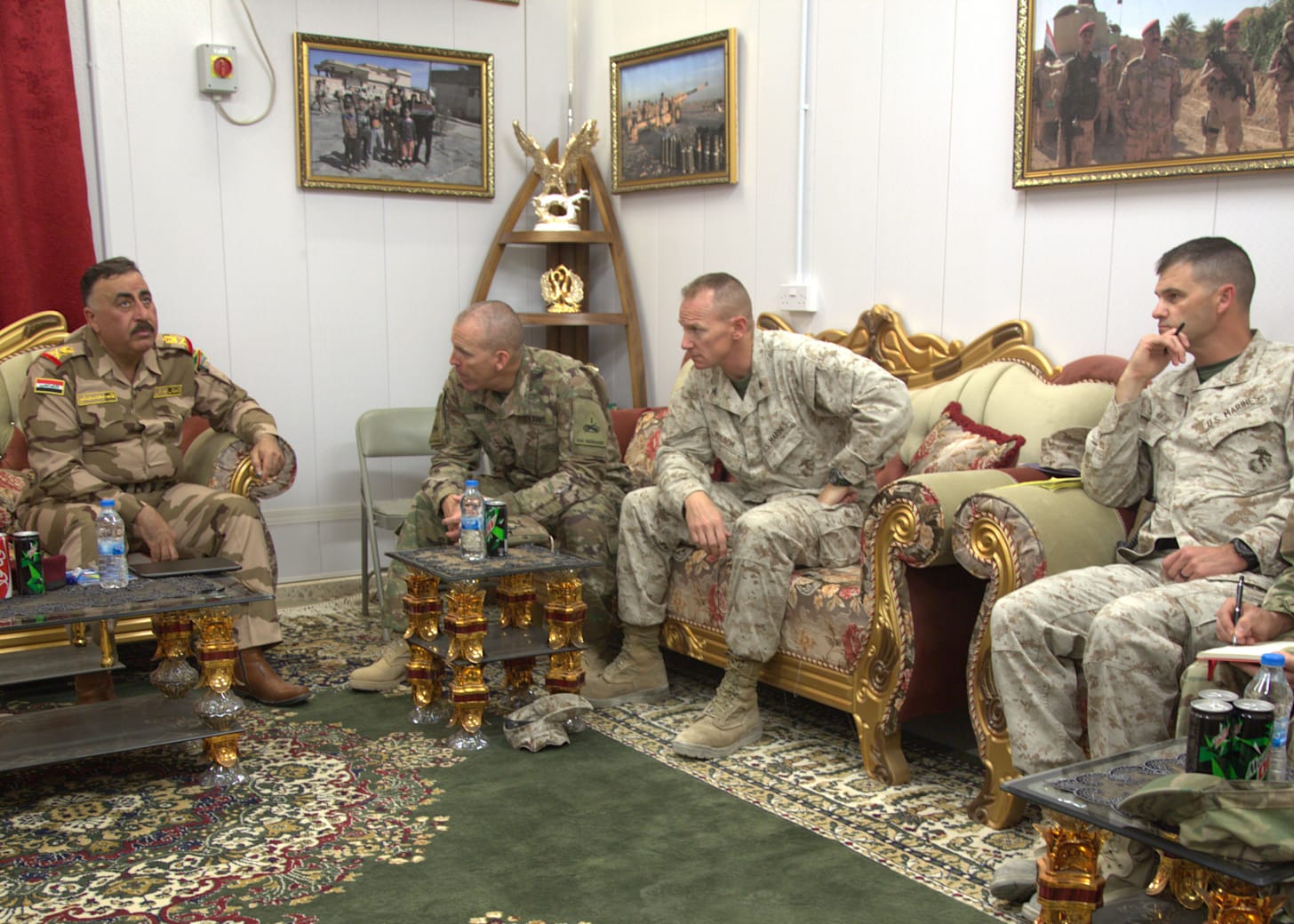 Iraqi and U.S. military leaders meet in a formal setting during a key leader engagement at the Task Force Lion command post.