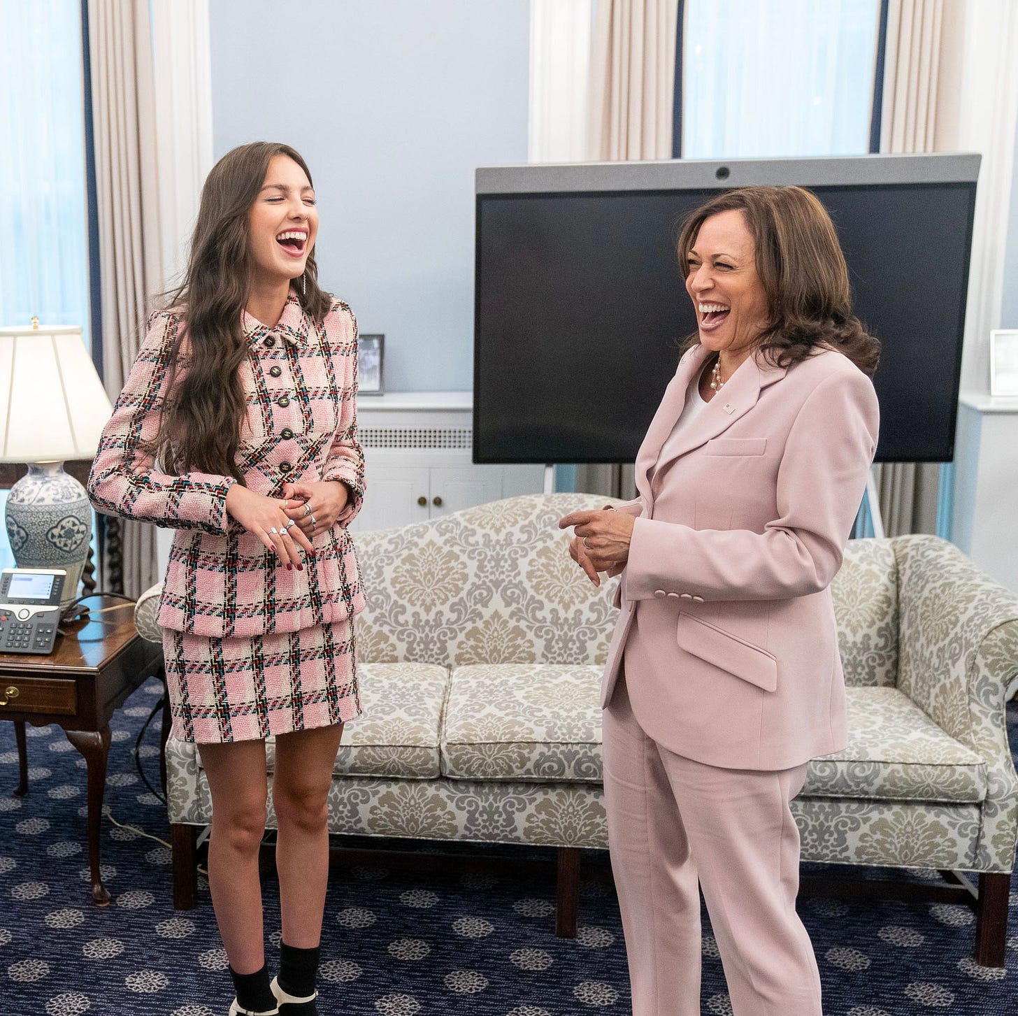 Vice President Kamala Harris and Olivia Rodrigo, laughing