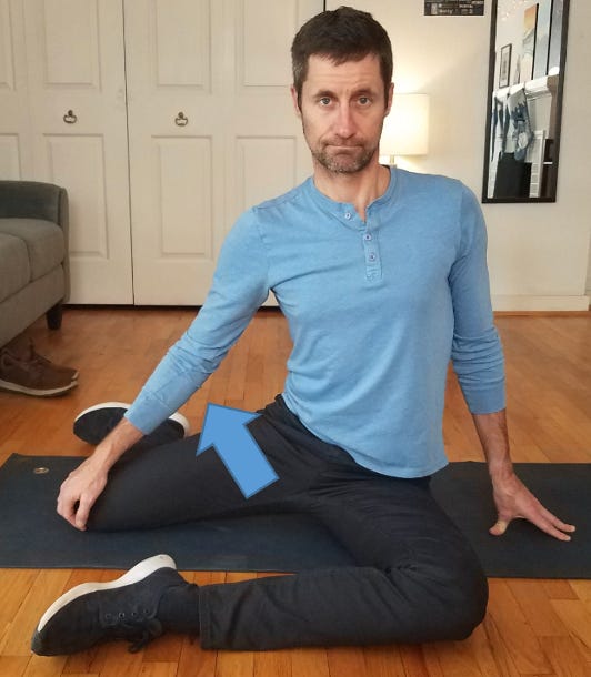 a man doing a hurdler stretch