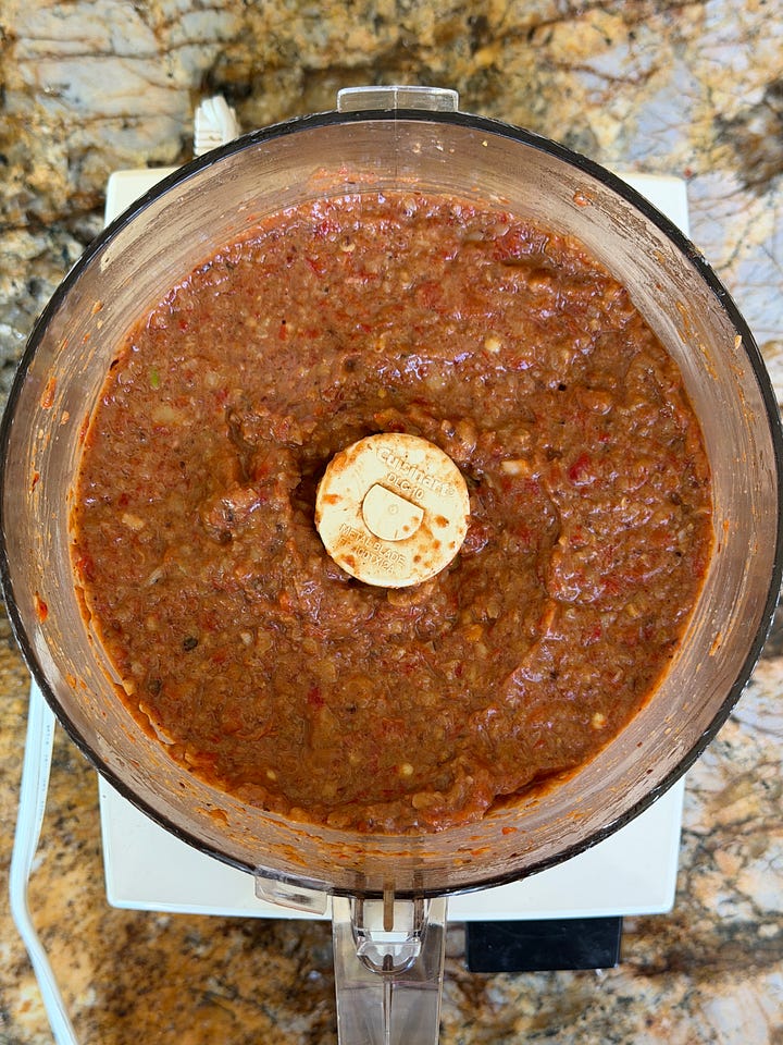 Two pictures of muhammara ingredients in a food processor before and after processing.