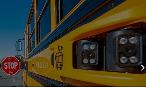 picture of kids getting on bus, speeding cameras