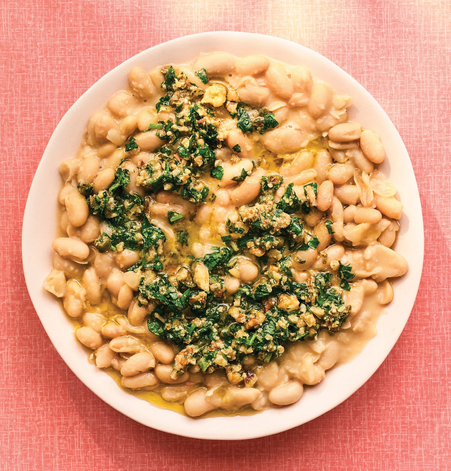 Plate of smashed white beans.