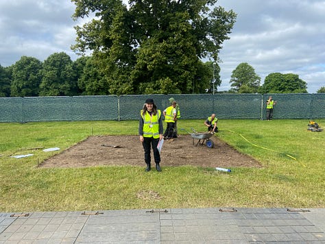 PIctures of a show garden being built at the RHS Hampton Court Garden Festival with a smiling garden designer.