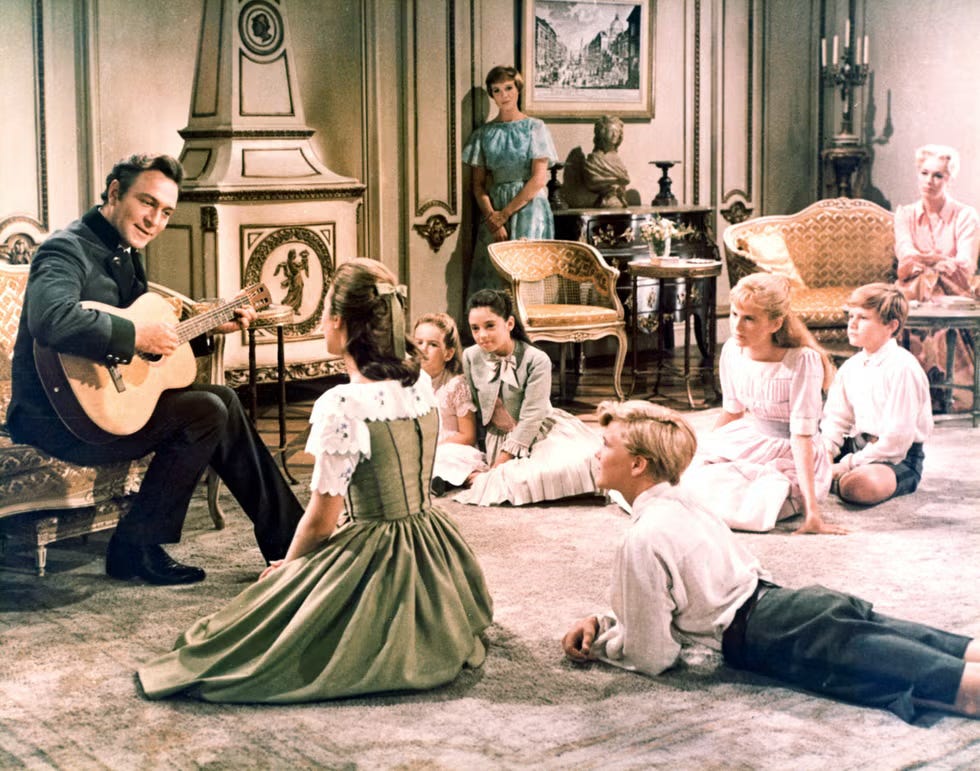 A father sings to his children in a scene from The Sound of Music