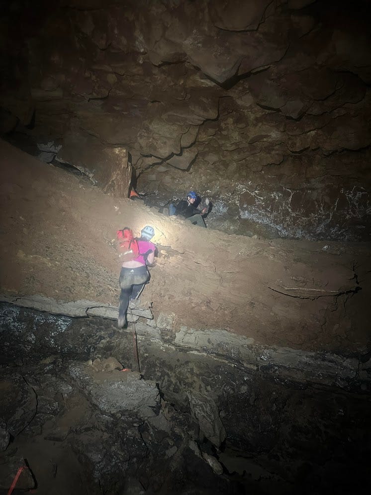 Riley climbing down a 15 ft dirt cliff with a handline Riley climbing down a 15 ft dirt cliff with a handline
