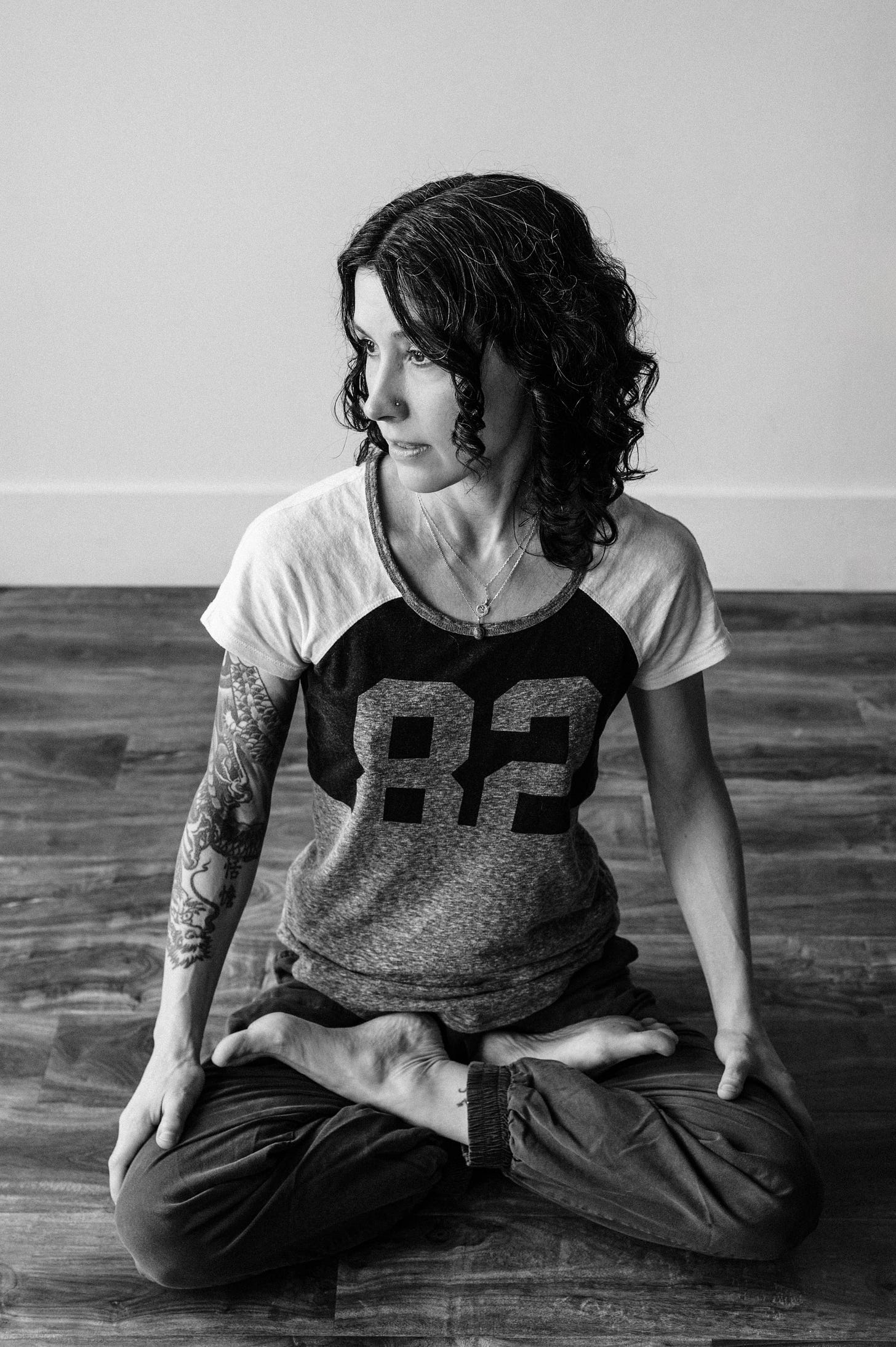 author seated in lotus clenching her jaw