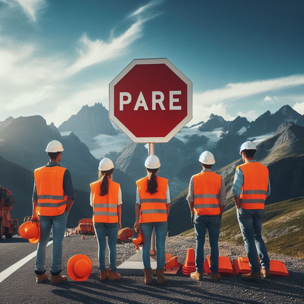 A stop sign next to workers in Chile