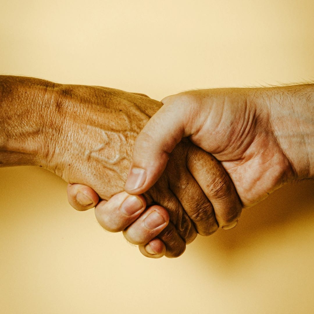 person holding babys hand