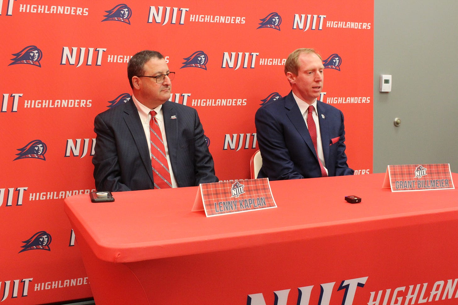 New coach Grant Billmeier (right) speaks to reporters alongside NJIT athletic director Lenny Kaplan on April 20, 2023. (Photo by Adam Zielonka) New coach Grant Billmeier (right) speaks to reporters alongside NJIT athletic director Lenny Kaplan on April 20, 2023. (Photo by Adam Zielonka)