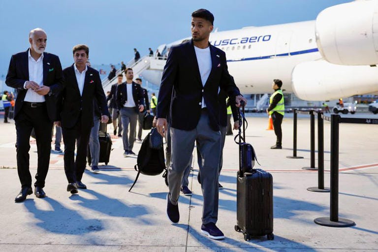 Iranian national team honors school bombing victims upon arrival in ... Iranian national team honors school bombing victims upon arrival in ...