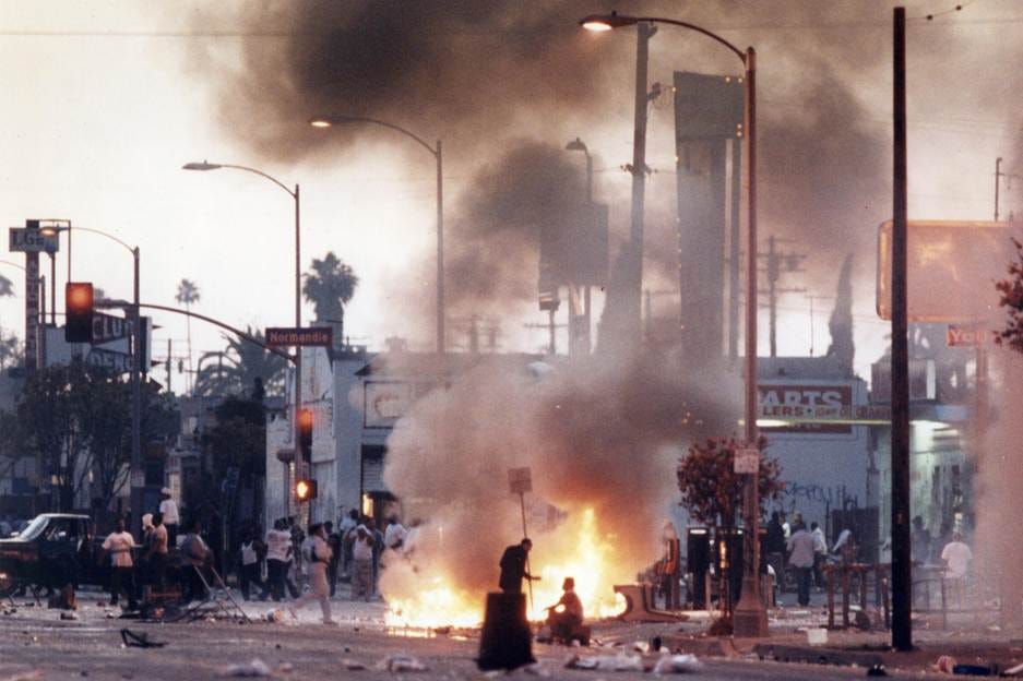 A group of people on a street with a fire

AI-generated content may be incorrect.