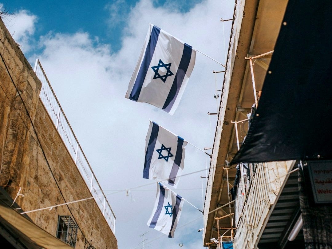 flags hanging on roof during daytime