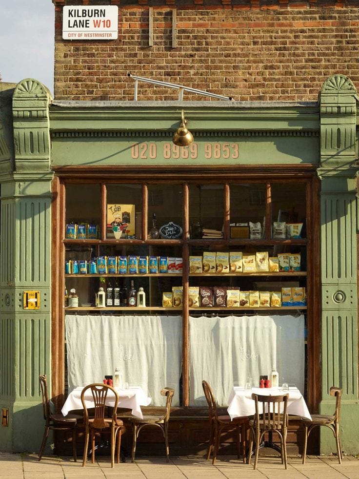 This may contain: the outside of a restaurant with tables and chairs
