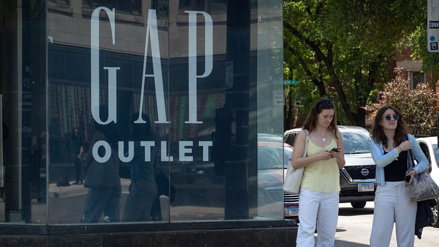 CHICAGO, ILLINOIS - MAY 29: A sign hangs in a GAP Outlet store window on May 29, 2025 in Chicago, Illinois. Despite beating expectations during its first-quarter results released today, Gap shares fell after the company said recently imposed tariffs could impact their bottom line by hundreds of millions of dollars. (Photo by Scott Olson/Getty Images) CHICAGO, ILLINOIS - MAY 29: A sign hangs in a GAP Outlet store window on May 29, 2025 in Chicago, Illinois. Despite beating expectations during its first-quarter results released today, Gap shares fell after the company said recently imposed tariffs could impact their bottom line by hundreds of millions of dollars. (Photo by Scott Olson/Getty Images)