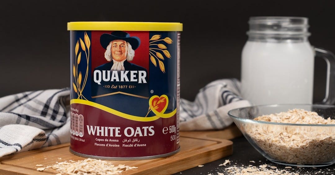 A can of oats next to a bowl of oats
