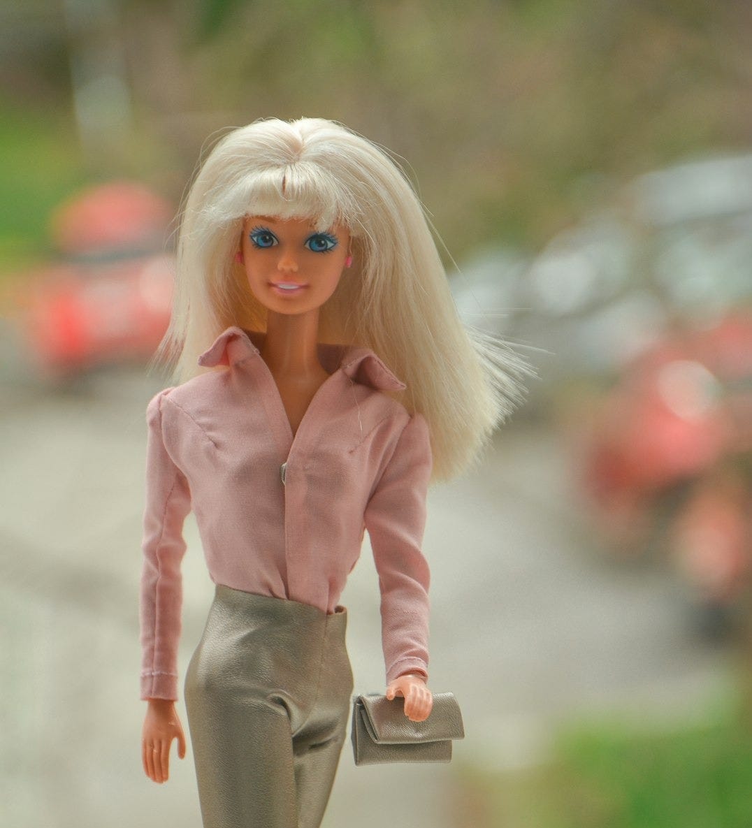 blonde haired girl in pink jacket and gray pants holding brown leather bag blonde haired girl in pink jacket and gray pants holding brown leather bag